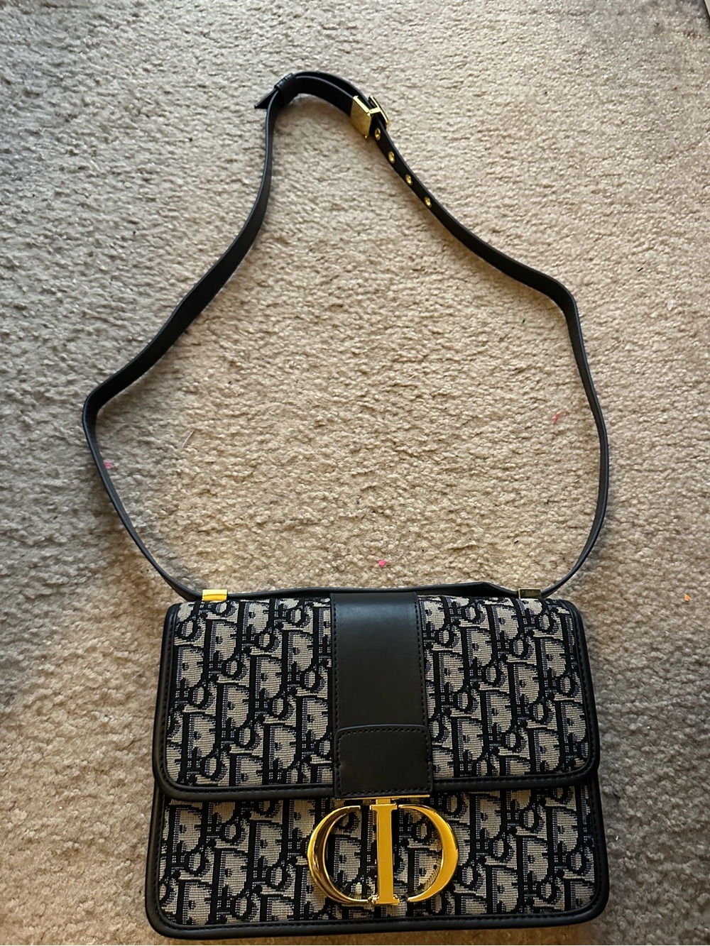 Oblique Canvas Saddle Crossbody in Black and Cream with Gold Hardware